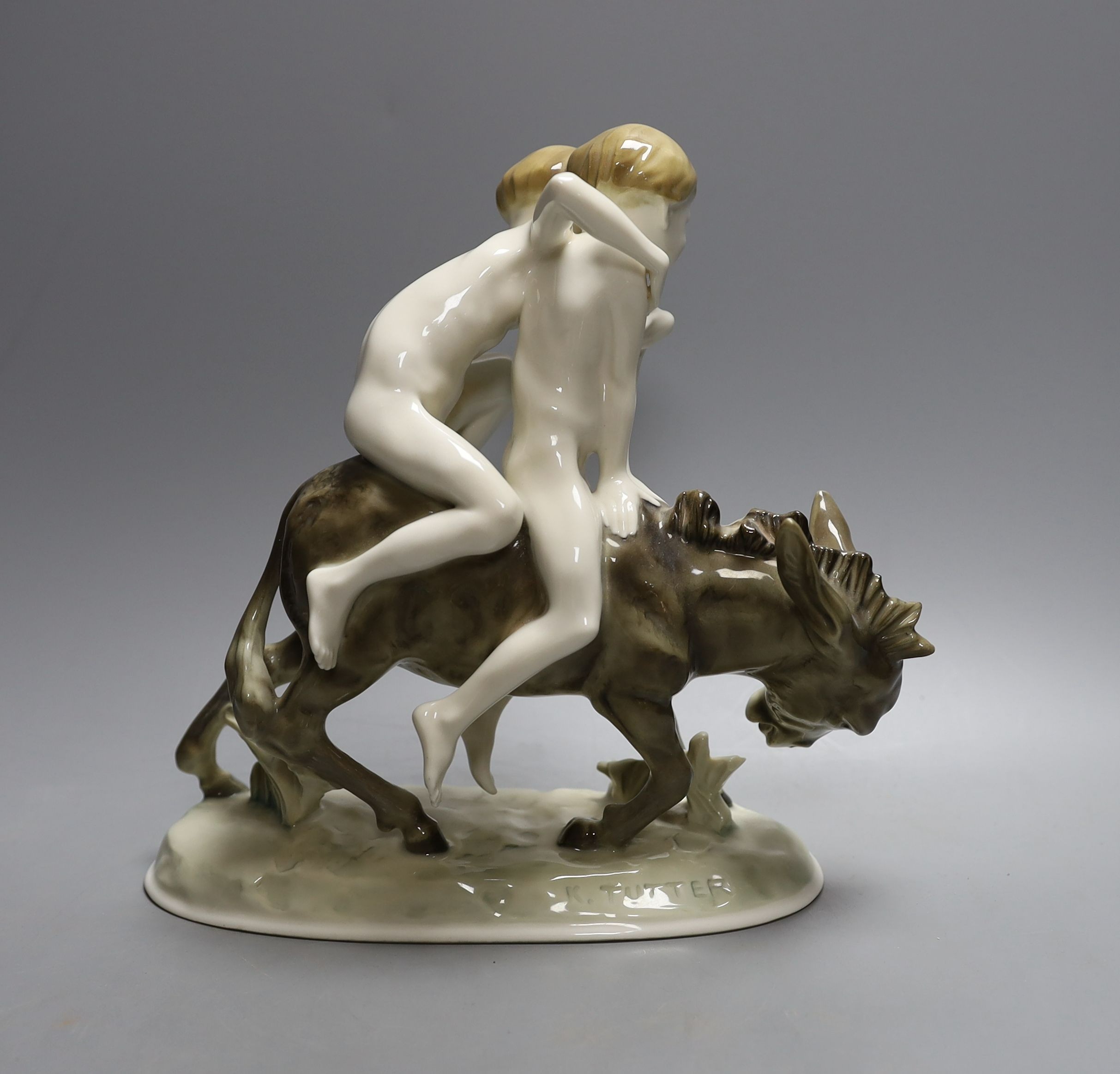 A Hutschenreuter porcelain group of two boys riding a donkey - 21.5cm tall